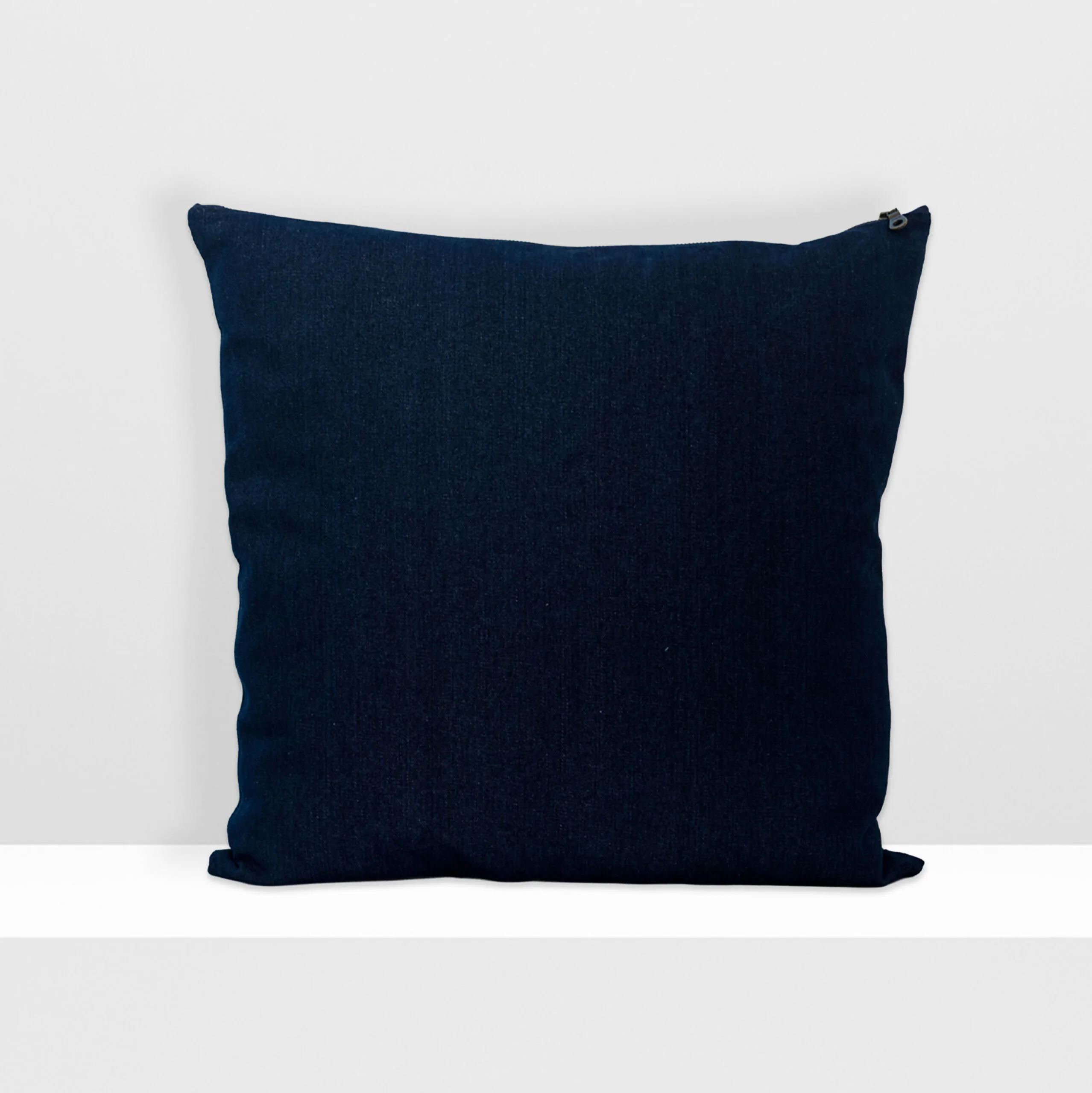 Back view of Digital Moss large pillow by MIN-studio, screen-printed denim with layered abstract moss-like textures in blue, white, grey, and glow yellow inks.