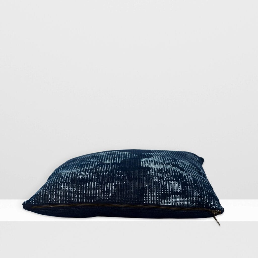 Side view of Digital Moss medium pillow by MIN-studio, screen-printed denim with layered abstract moss-like textures in blue, white, grey inks.