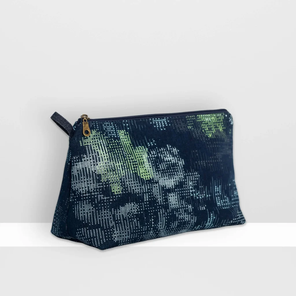 Large Digital Moss beauty bag by MIN-studio with glow yellow layered screen print forming abstract moss textures on denim patchwork.