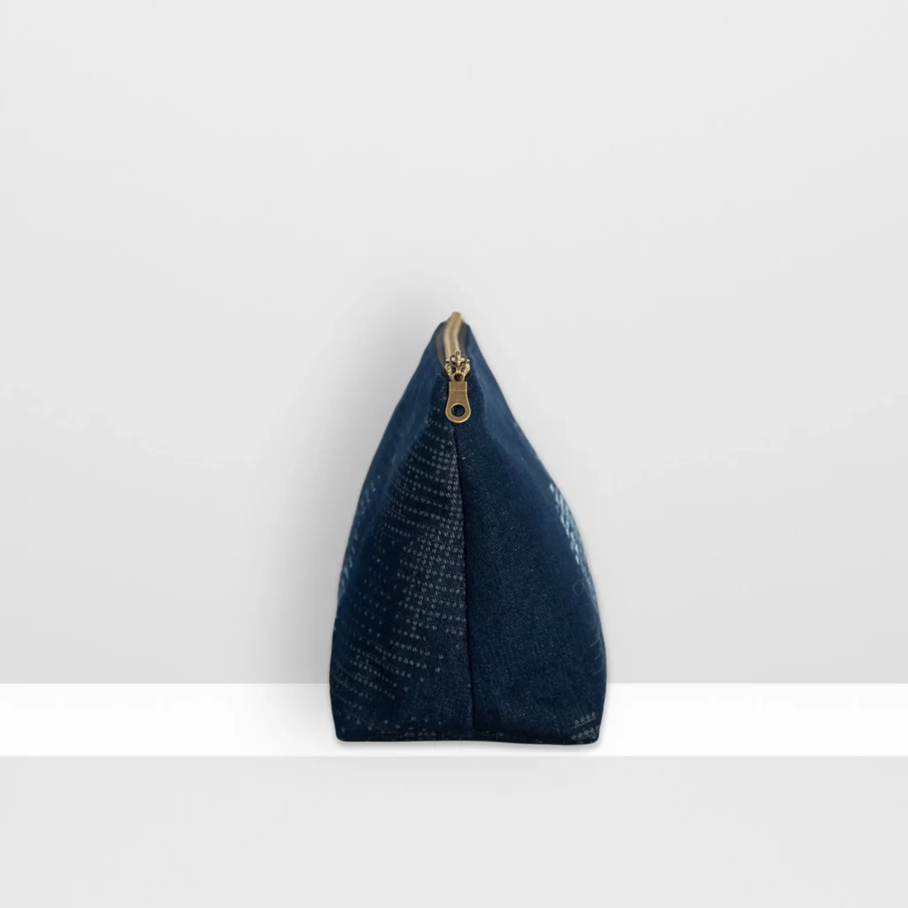 Side view of large Digital Moss beauty bag showing grey-blue screen-printed moss pattern and patchwork construction.