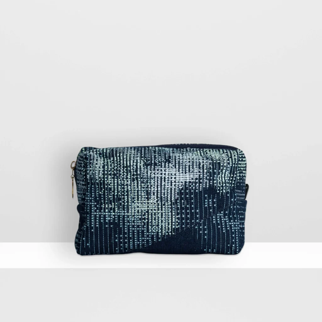 Back view of medium Digital Moss beauty bag showing glow yellow screen-printed moss pattern and patchwork denim construction.