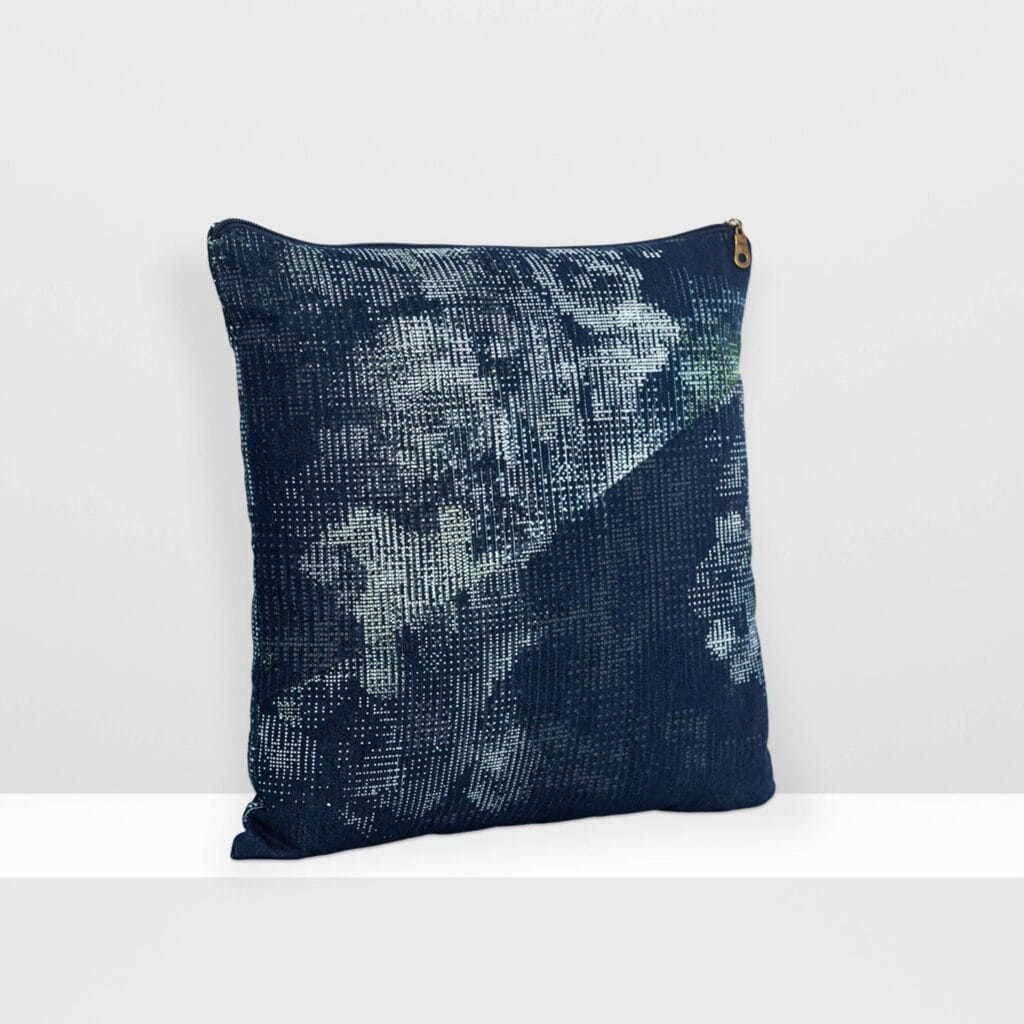 Front view of Digital Moss medium pillow by MIN-studio, screen-printed denim with layered abstract moss-like textures in blue, white, grey, and glow yellow inks.