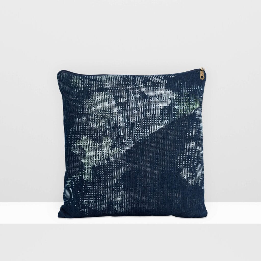 Front view of Digital Moss medium pillow by MIN-studio, screen-printed denim with layered abstract moss-like textures in blue, white, grey, and glow yellow inks.