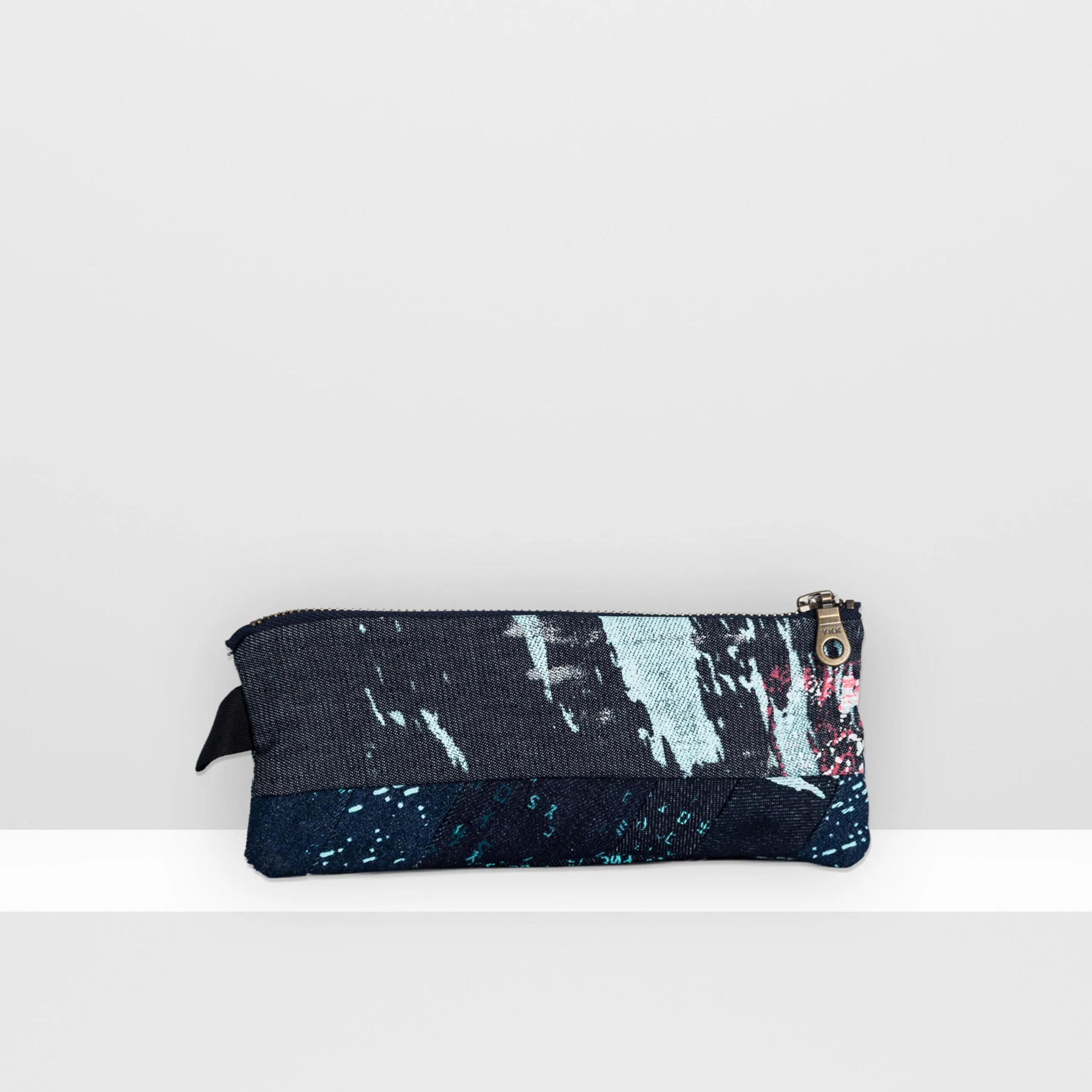 Back view of Space Collection pencil case showing multi-layered moon surface pattern in blue, grey, and neon pink inks on screen-printed denim.