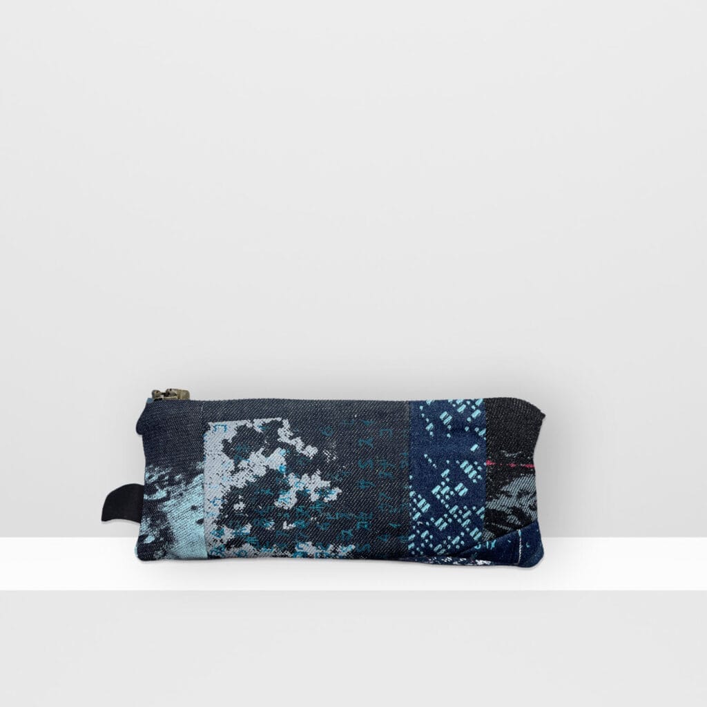 Back view of Space Collection pencil case showing multi-layered moon surface pattern in blue, grey, and neon pink inks on screen-printed denim.